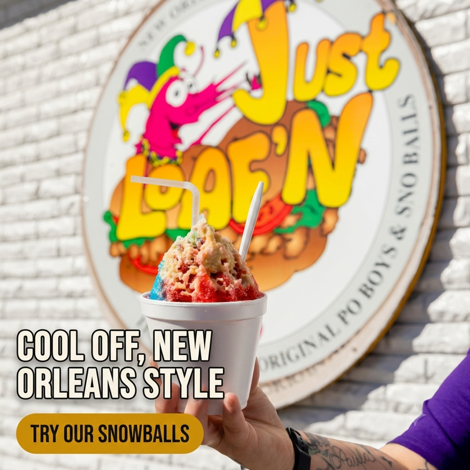 Hand holds a colorful New Orleans-style snowball dessert in a cup before a vibrant Frosty snowball shop sign.
